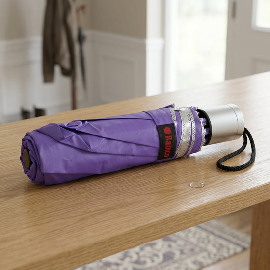 Lightweight triple-fold travel umbrella