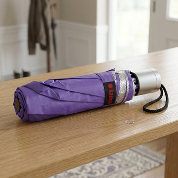 Lightweight triple-fold travel umbrella