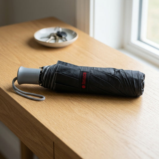 Compact triple-fold rain umbrella for daily travel