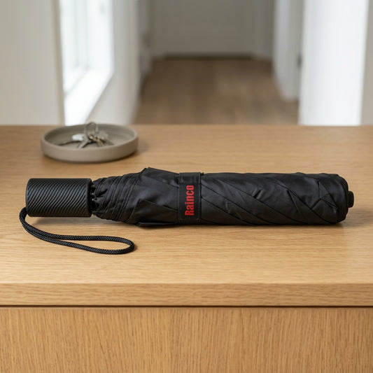 Compact double-fold travel umbrella for rainy weather