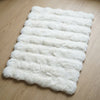Soft rectangular floor mat in cream for home interiors