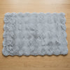 Soft rectangular floor mat in gray for home interiors