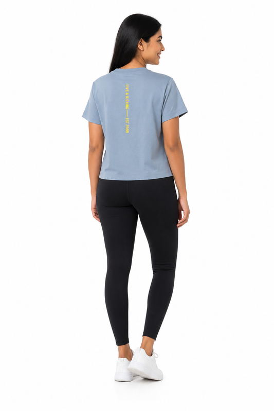 Back view of women's blue graphic T-shirt with printed detail