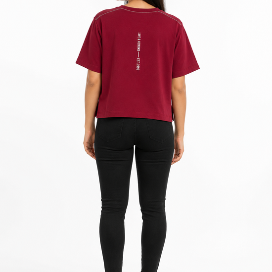 Back view of women's maroon graphic T-shirt