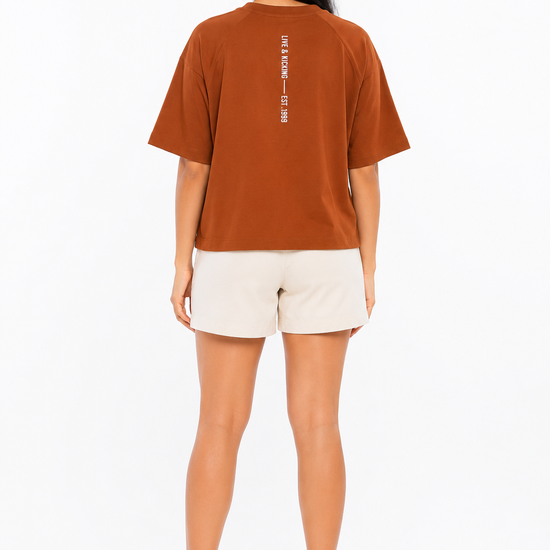 Back view of women's rust graphic T-shirt