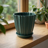 Dark teal ridged flower pot with matching tray