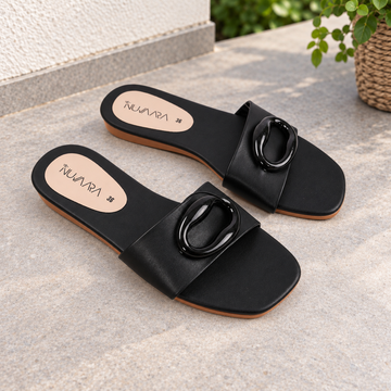 Nuvaara women's black flat slide sandals with glossy oval buckle accent and square toe