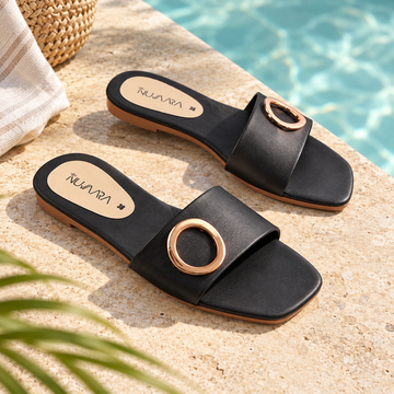 Nuvaara women's black faux leather flat slide sandals with polished gold circular ring buckle