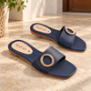 Nuvaara women's black faux leather flat slide sandals with polished gold circular ring buckle