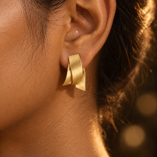 NUVAARA brushed gold-tone twisted ribbon huggie hoop earrings
