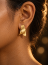 NUVAARA brushed gold-tone twisted ribbon huggie hoop earrings