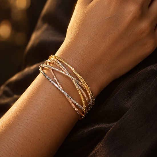 NUVAARA tri-tone intertwined textured wire bangle bracelet on wrist