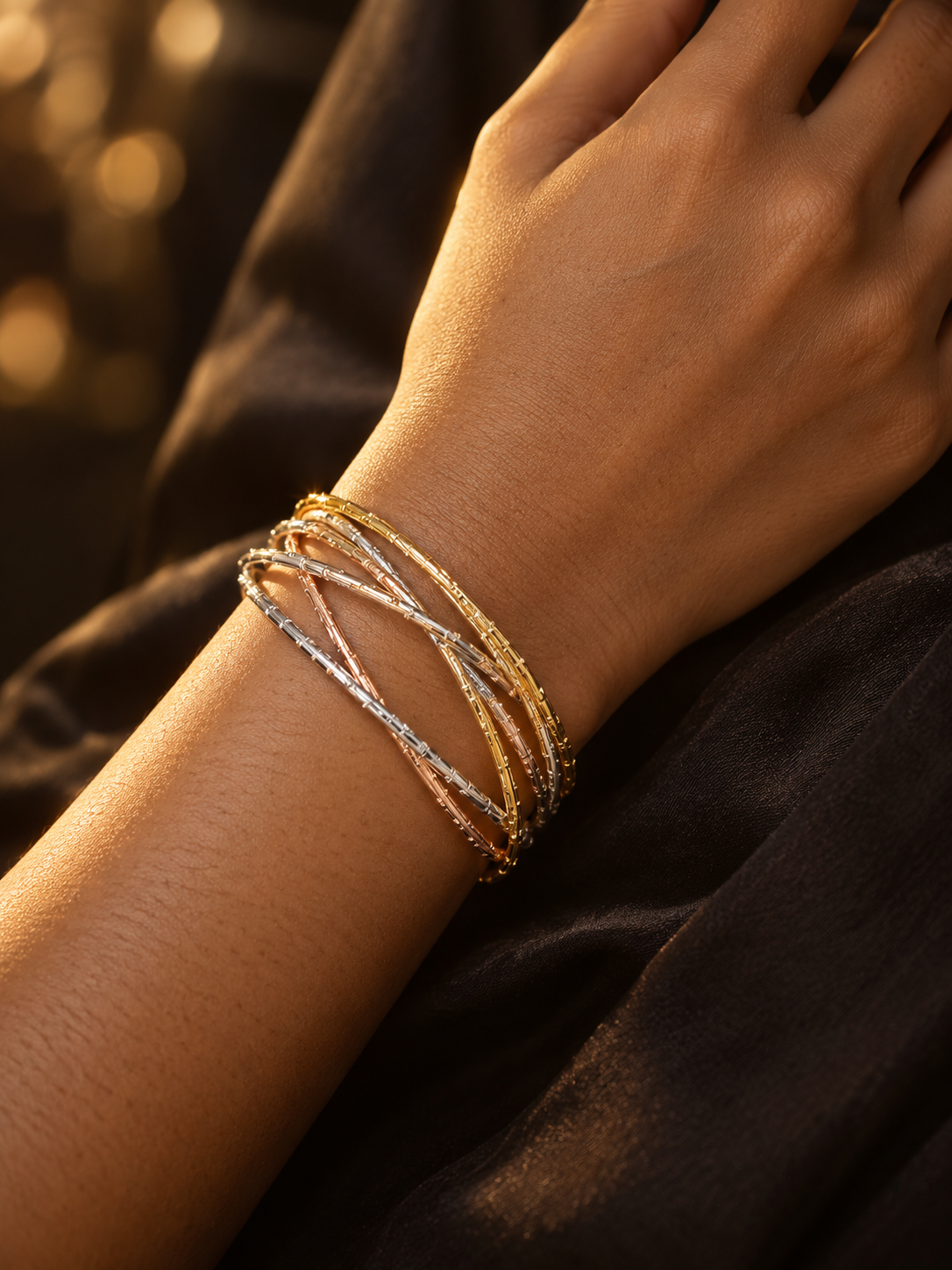 NUVAARA tri-tone intertwined textured wire bangle bracelet on wrist