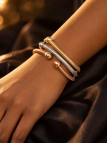 NUVAARA tri-color coiled cable wire open cuff bangles with ball finials on wrist
