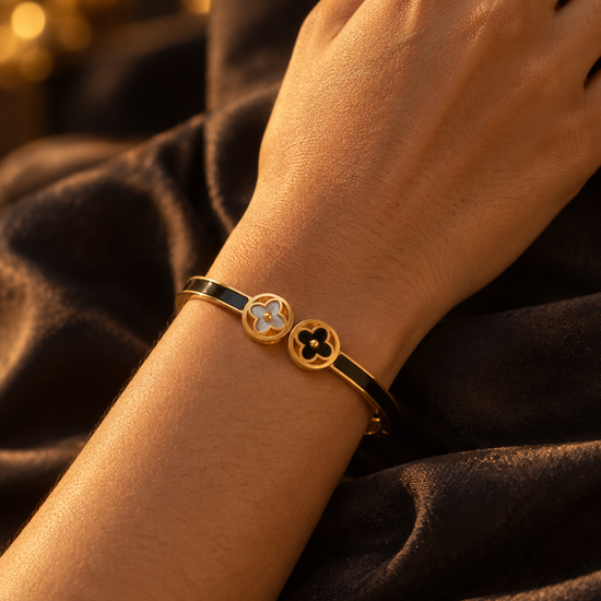 NUVAARA black enamel hinged bangle bracelet with mother-of-pearl twin clover charm
