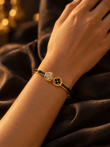 NUVAARA black enamel hinged bangle bracelet with mother-of-pearl twin clover charm