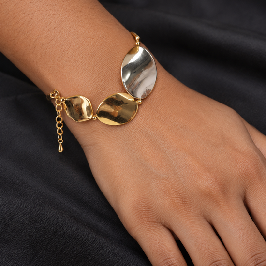 NUVAARA sculptural molten petal two-tone gold and silver link bracelet on model wrist