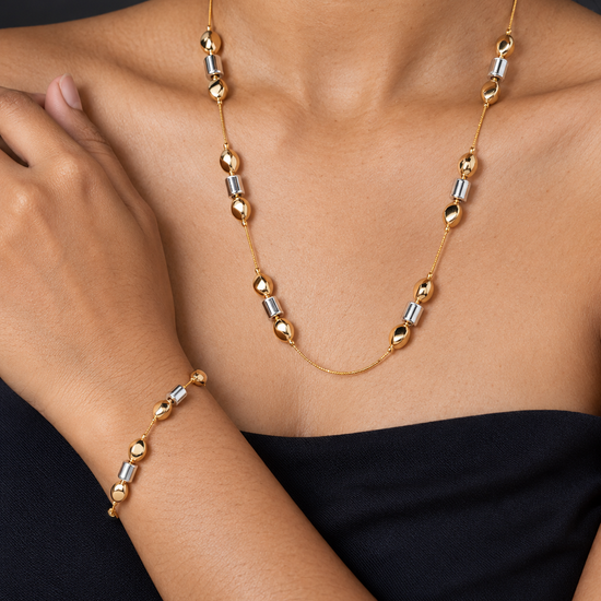 NUVAARA two-tone gold oval and silver cylinder bead station necklace and matching bracelet set