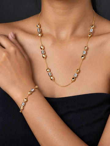 NUVAARA two-tone gold oval and silver cylinder bead station necklace and matching bracelet set