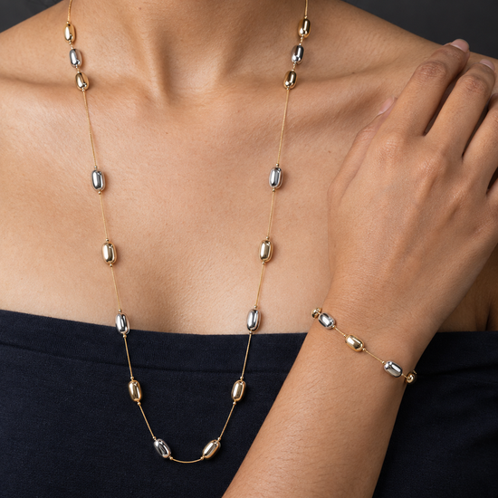 NUVAARA two-tone elongated gold and silver pebble bead station necklace and bracelet set