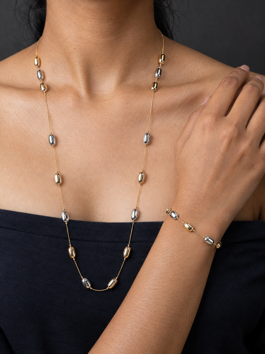 NUVAARA two-tone elongated gold and silver pebble bead station necklace and bracelet set