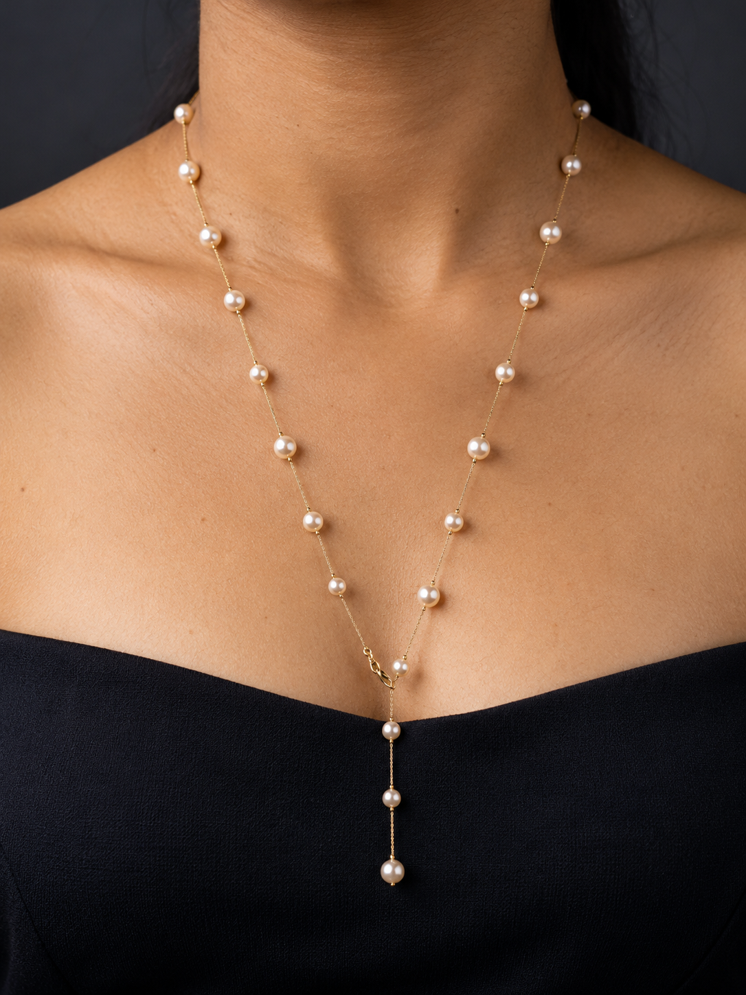 NUVAARA gold chain and faux pearl station Y-drop lariat necklace on model