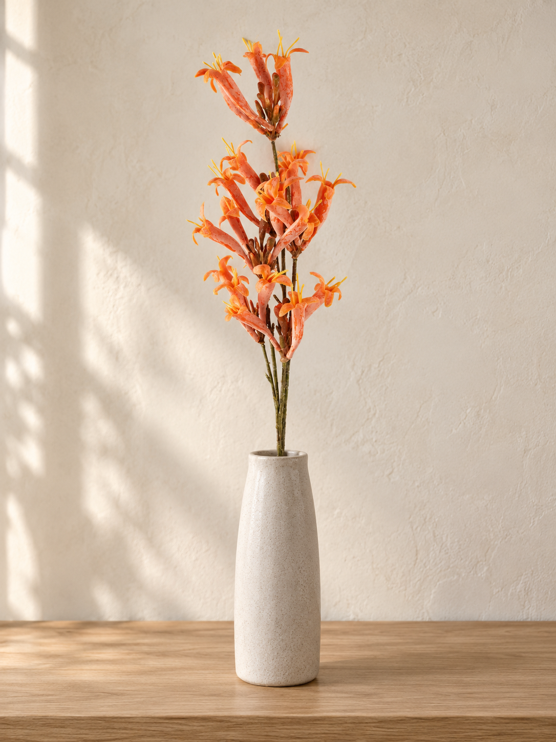 T & Co. 68cm artificial orange trumpet flower stem spray arranged in ceramic vase