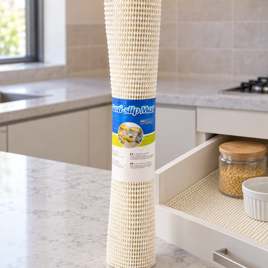 T&CO cushioned mesh anti-slip drawer and shelf grip mat roll 45x150cm in cream shown inside open kitchen drawer
