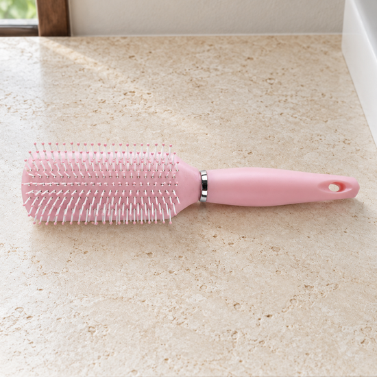 T&CO ergonomic cushioned detangling paddle hair brush with ball-tipped nylon bristles in pastel baby pink