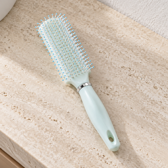 T&CO ergonomic cushioned detangling paddle hair brush with ball-tipped nylon bristles in pastel mint green