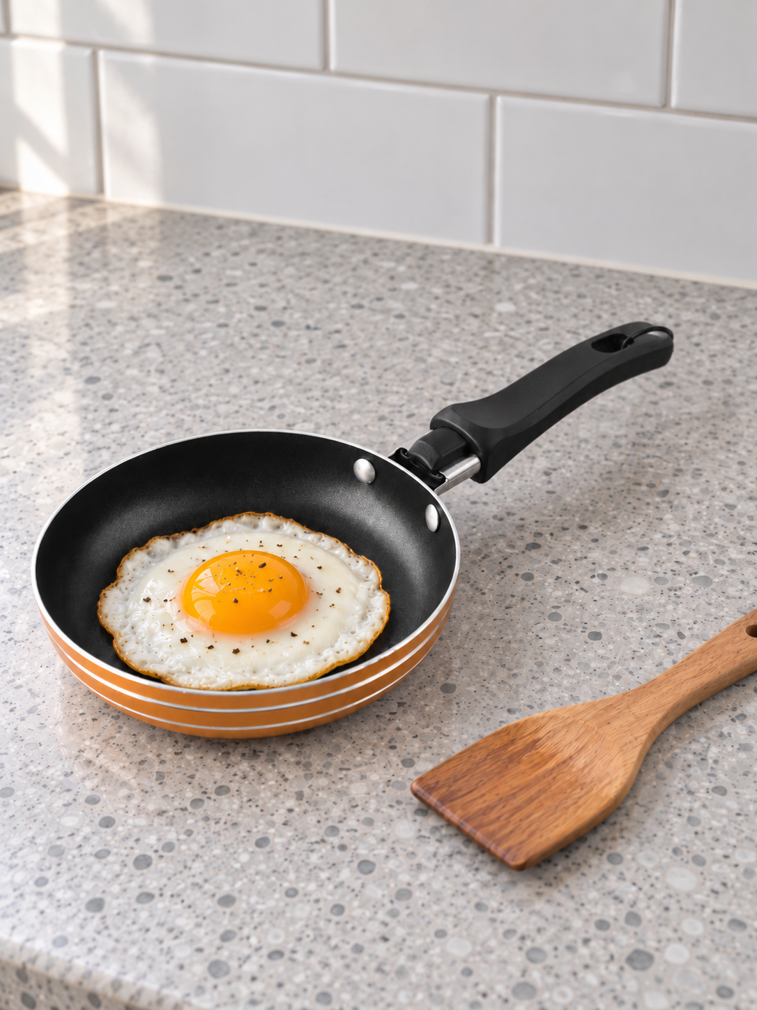T&CO mini non-stick 12cm single egg and pancake frying pan skillet in warm metallic orange with mini wooden spatula