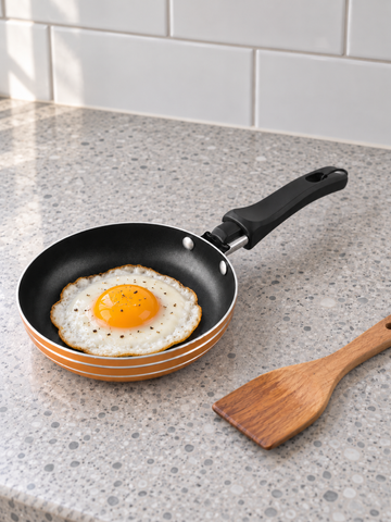 T&CO mini non-stick 12cm single egg and pancake frying pan skillet in warm metallic orange with mini wooden spatula