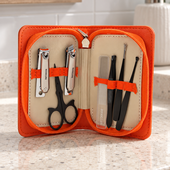 6-piece travel manicure and grooming kit in vibrant orange faux-leather zippered case