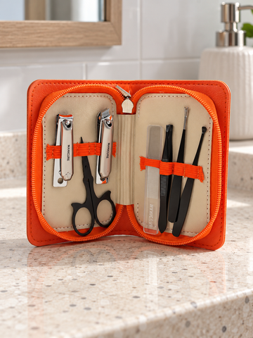 6-piece travel manicure and grooming kit in vibrant orange faux-leather zippered case
