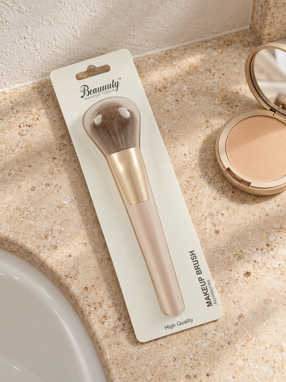 Beauuuty fluffy dome powder and blush makeup brush with matte champagne gold ferrule and nude blush handle in retail blister packaging