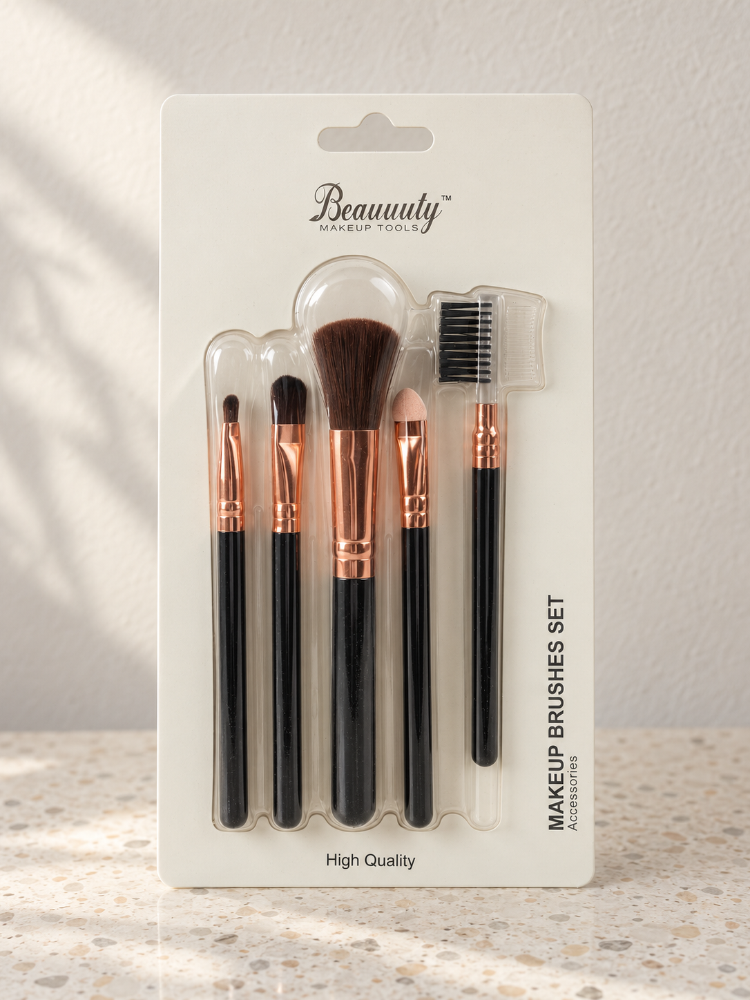 Beauuuty 5-piece travel cosmetic makeup brush set with rose gold ferrules and glossy black handles in retail blister pack