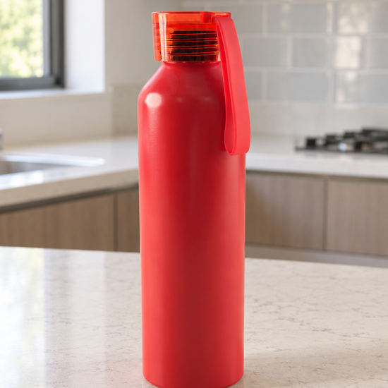 Vibrant crimson red reusable sports water bottle with translucent red leak-resistant screw cap and carry loop