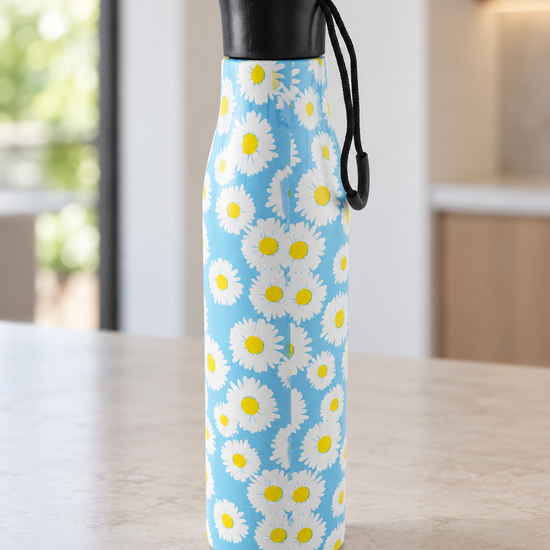 T&CO insulated stainless steel water bottle with cheerful white daisy floral print on sky blue background and black screw cap carry loop