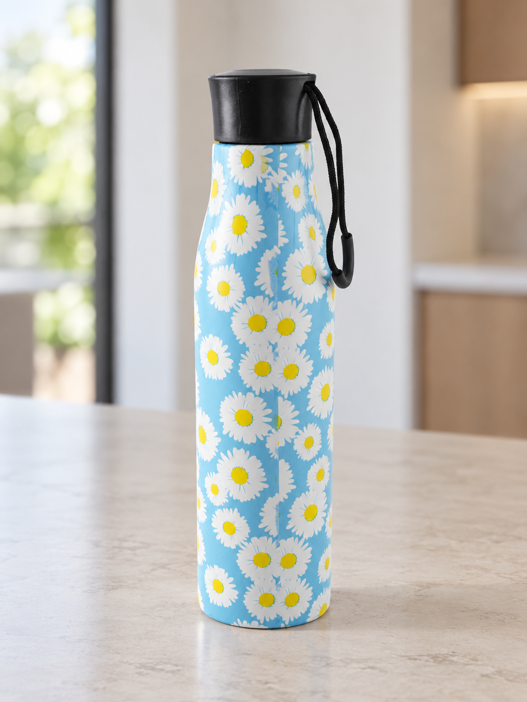 T&CO insulated stainless steel water bottle with cheerful white daisy floral print on sky blue background and black screw cap carry loop