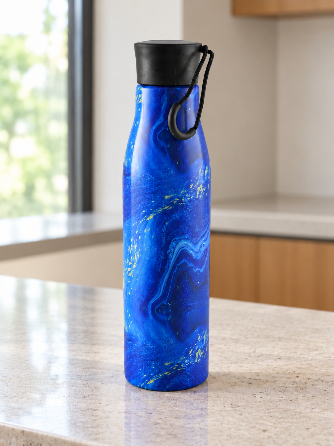 T&CO insulated stainless steel water bottle with vibrant ocean blue marble swirls and gold vein accents with carry loop cap
