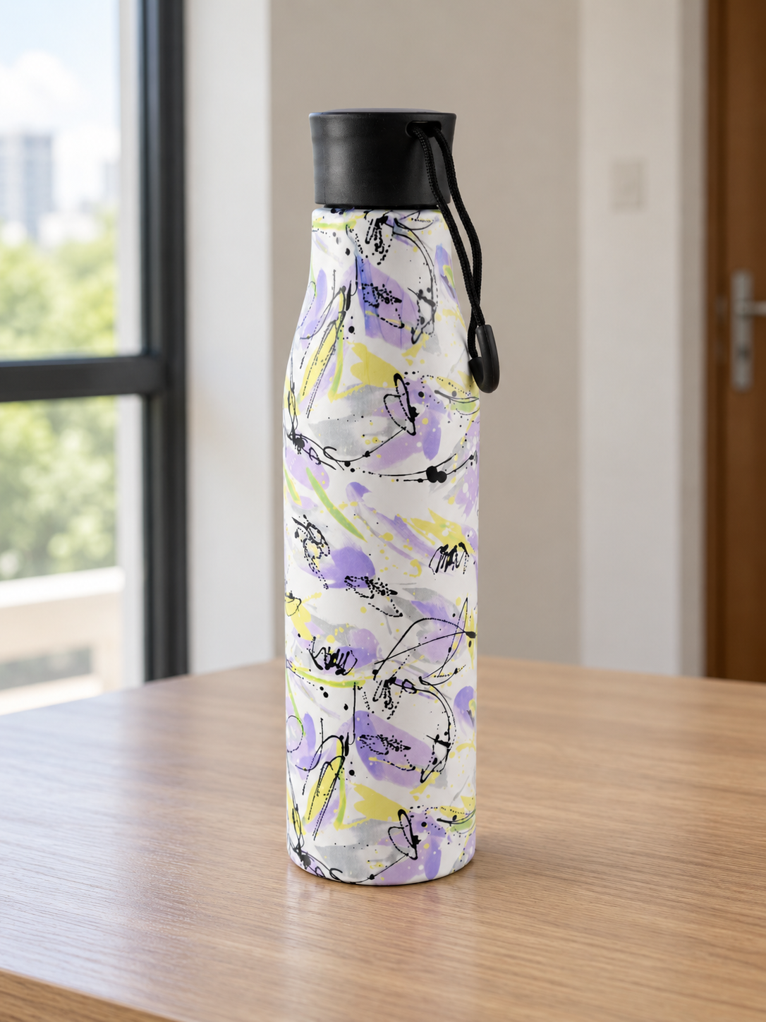 T&CO insulated stainless steel water bottle featuring an artistic lavender and yellow watercolor floral motif with black carry cord loop