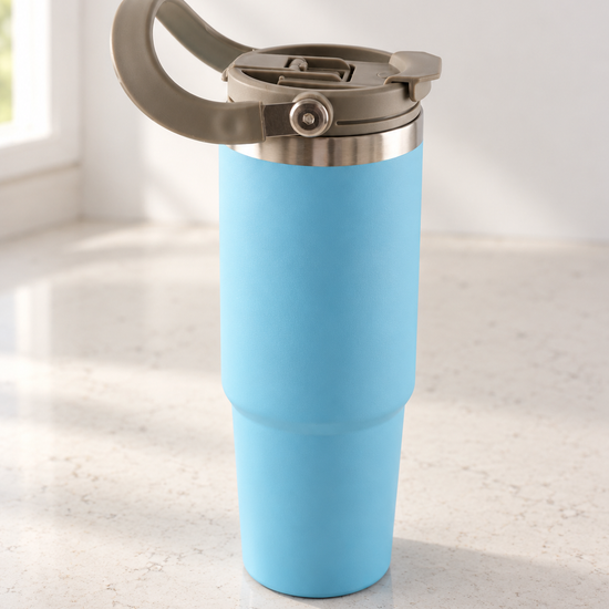 T&CO sky blue vacuum insulated travel tumbler with khaki grey swing carry handle and flip sip lid