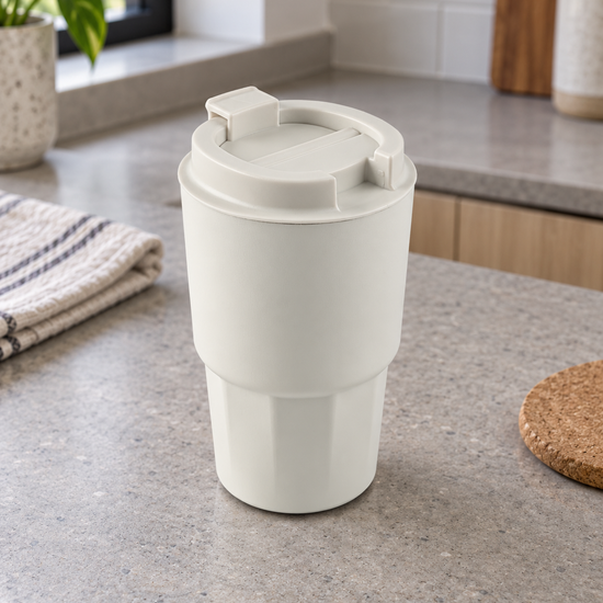 T&CO ivory white insulated coffee travel tumbler with geometric faceted base and hinged flip-top sipping lid