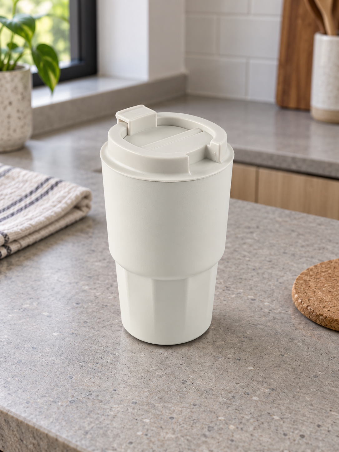 T&CO ivory white insulated coffee travel tumbler with geometric faceted base and hinged flip-top sipping lid