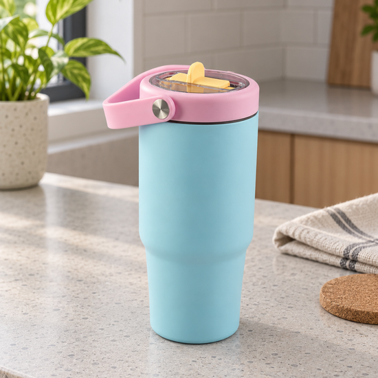 T&CO pastel sky blue vacuum insulated travel tumbler with pastel pink swing carry handle and transparent sip lid