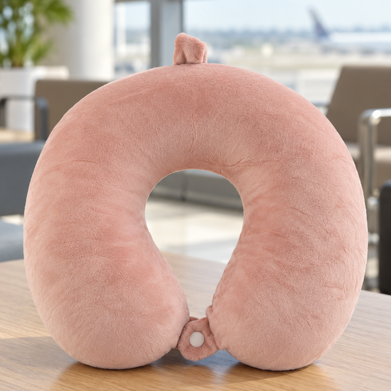 T&CO dusty rose pink soft plush U-shaped memory foam travel neck pillow with front snap button closure and luggage hanging loop