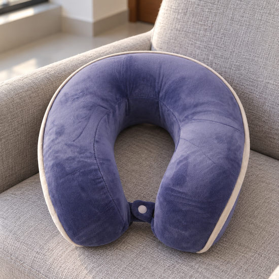T&CO lavender purple contoured memory foam travel neck pillow with white edge piping and snap strap closure
