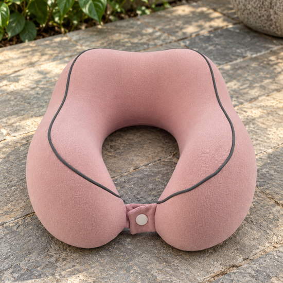 T&CO dusty pink contoured memory foam travel neck pillow with dark contrast piping and snap button strap