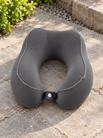 T&CO charcoal grey ergonomic contoured memory foam travel neck pillow with contrast piping and front snap button strap