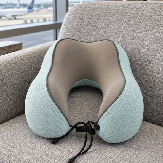 T&CO sky blue ribbed knit memory foam neck pillow with taupe interior lining and adjustable toggle drawstring